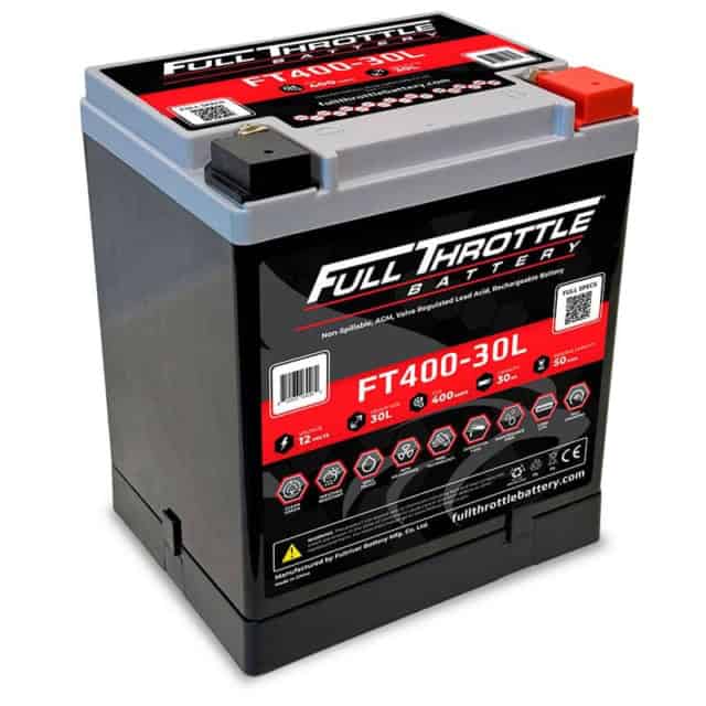 A full throttle FT310-20L car battery with red and black details, displaying voltage and capacity information.