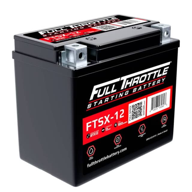 A black Full Throttle starting battery, model FTSX-12, is shown upright with its red and white label visible.