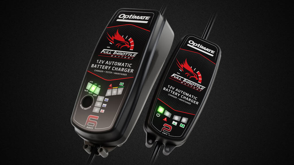 Two Optimate Full Throttle 12V automatic battery chargers with digital displays and indicator lights shown on a black background.