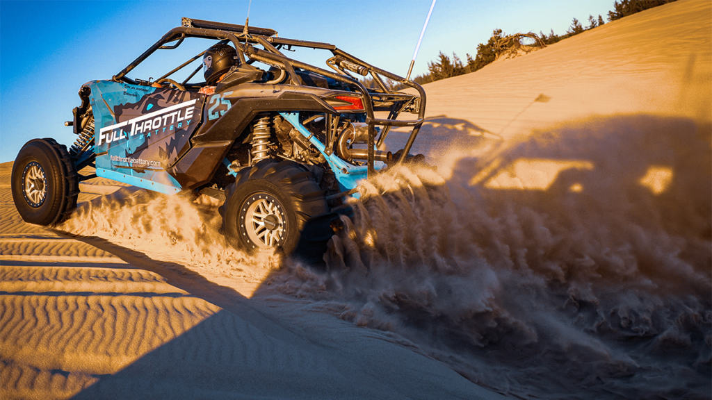 Full Throttle side by side riding in the sand dunes.