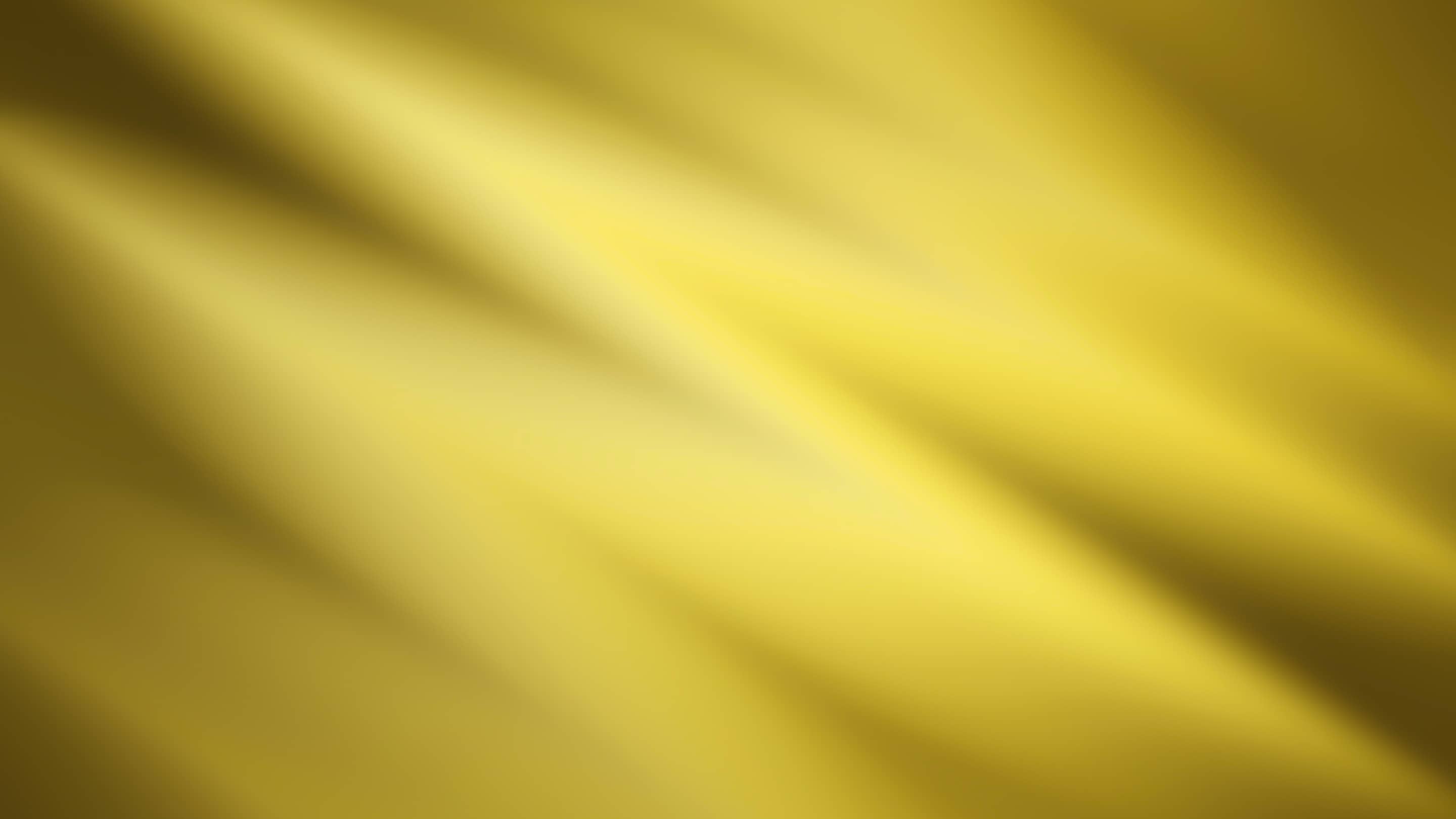 A gold background with a lot of wavy lines.
