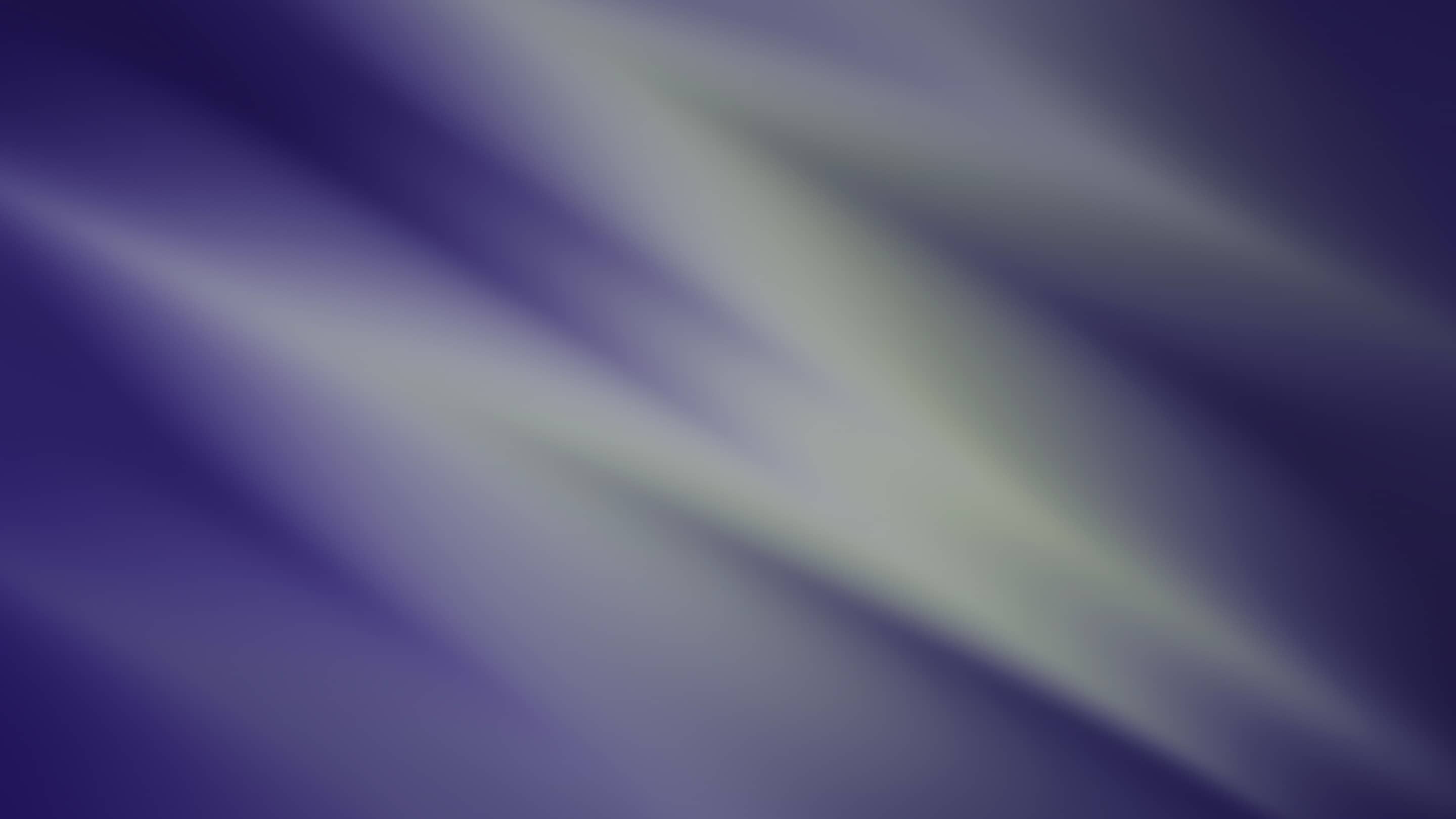 A purple and green blurred background.
