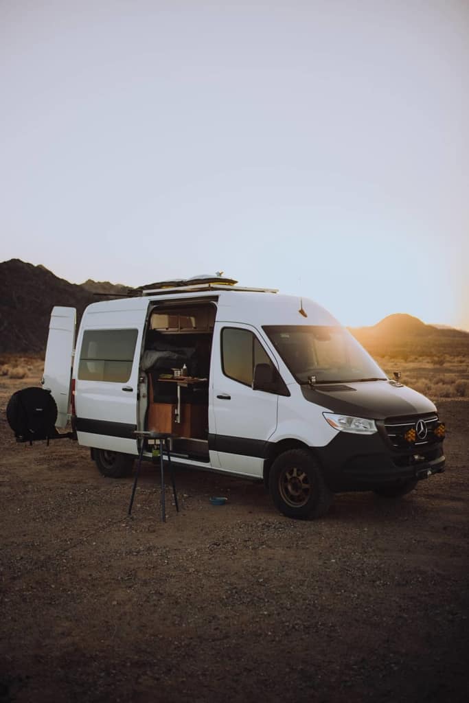 Cameron's van parked in the desert ready for camping.