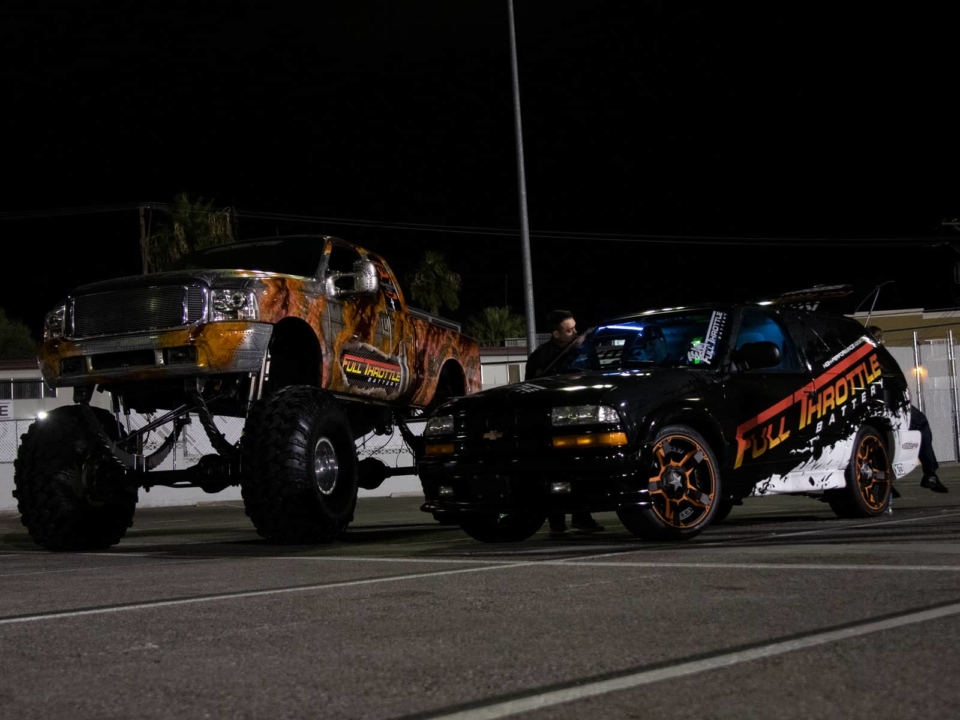 Two Team Full Throttle vehicles, Gary Killian's monster truck and John Nolte's Blazer