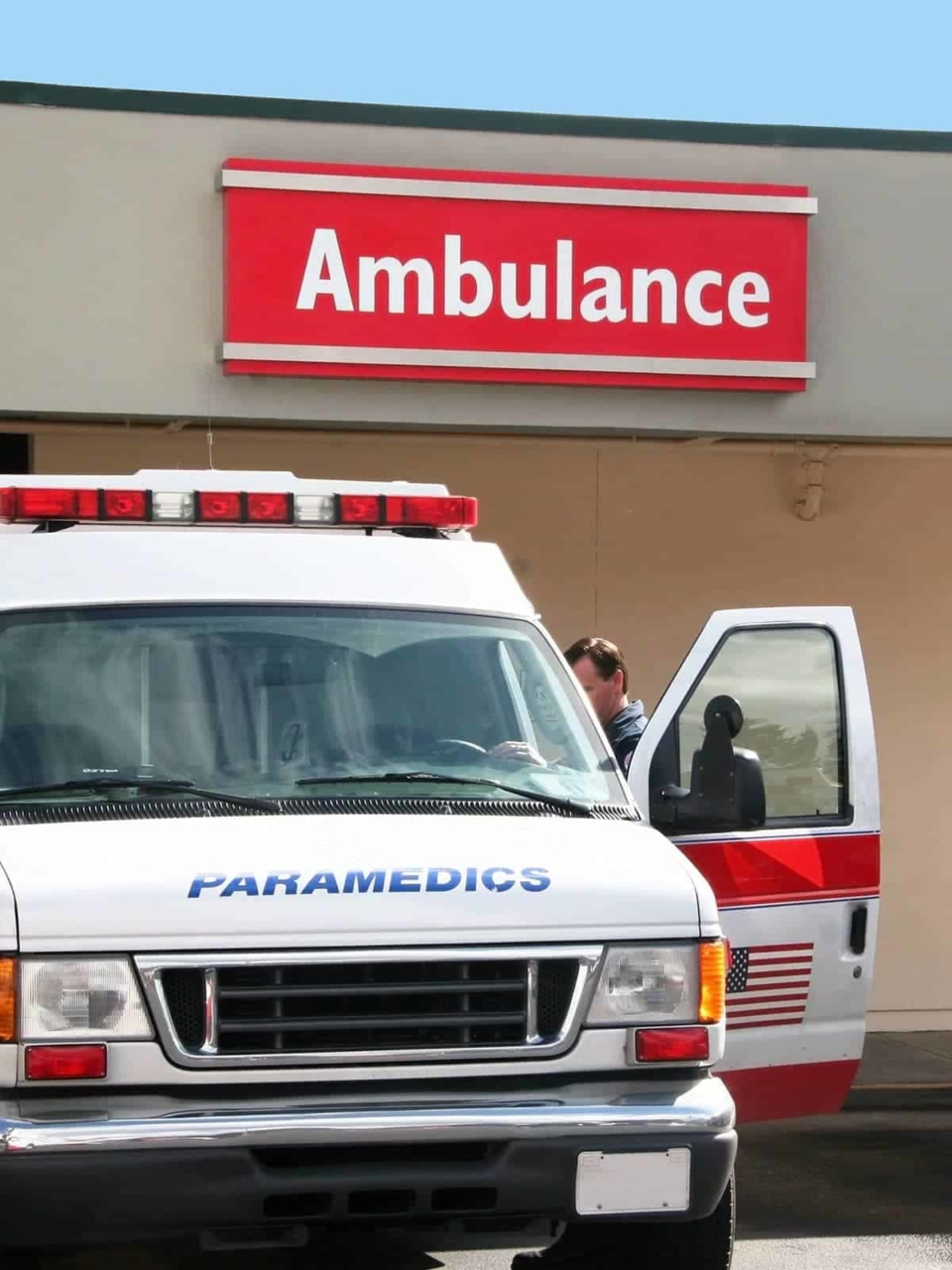 Ambulance parked out in front of a hospital