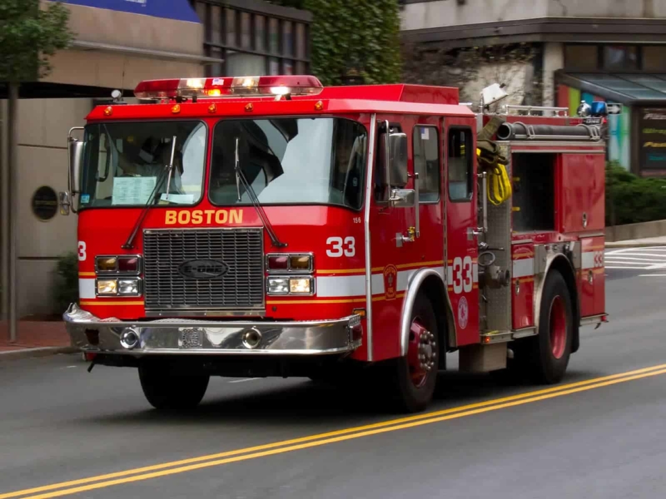 Boston fire truck driving down the street