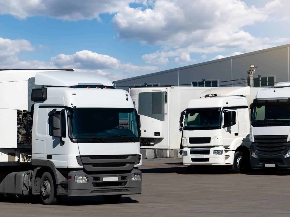 Fleet of delivery trucks in a parking lot
