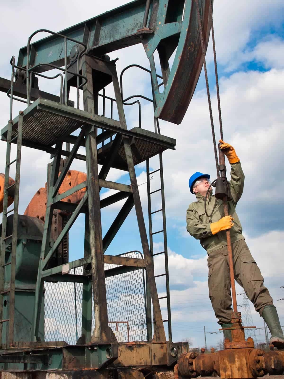 Man working on oil pump