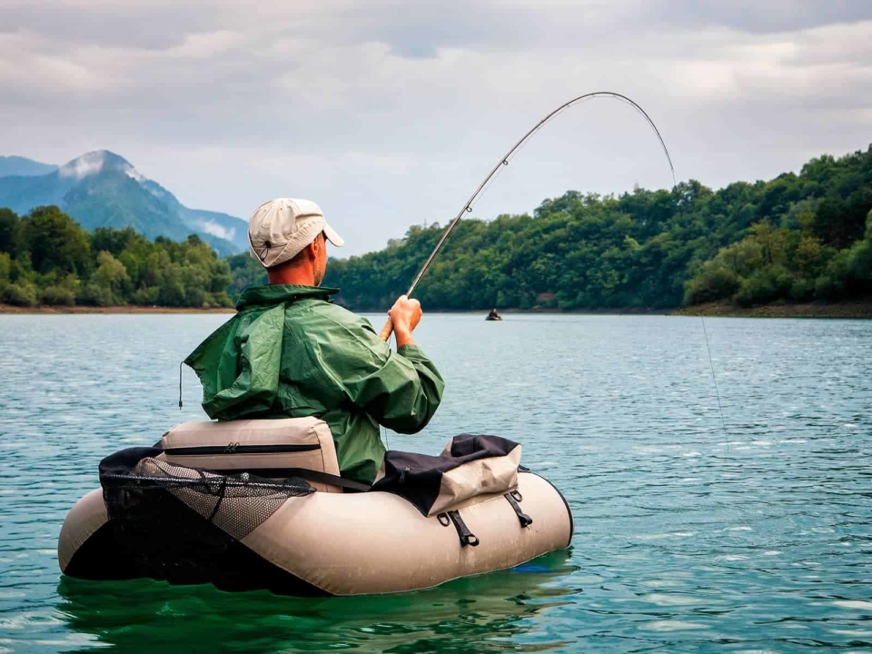 Man float tube fishing on a lake