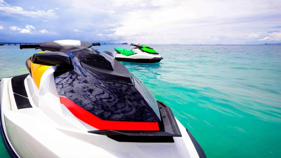 Two high-performance jet skis sitting in the water